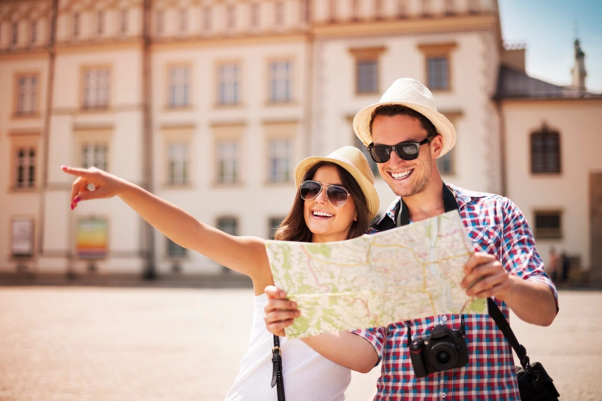 couple sightseeing with map